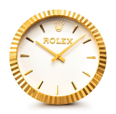 View full screen - View 1 of Lot 8058. ROLEX, MANUFACTURED BY INDUCTA | A GILT BRASS WALL CLOCK, CIRCA 2010 | 勞力士,由 INDUCTA 製作 | 鍍金銅製掛鐘,約2010年製.
