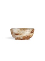 A superb and rare jade 'chilong' cup, Song dynasty or earlier | 宋或較早 白玉帶皮螭龍紋盃