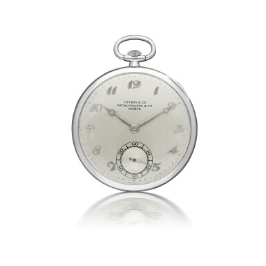 View full screen - View 1 of Lot 139. PATEK PHILIPPE | RETAILED BY TIFFANY & CO.: A PLATINUM OPEN FACED WATCH CIRCA 1940.