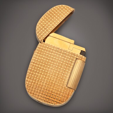 View full screen - View 1 of Lot 645. 'Ocean' Golden Ellipse, Reference 9504 | A yellow gold lighter | Circa 1978.