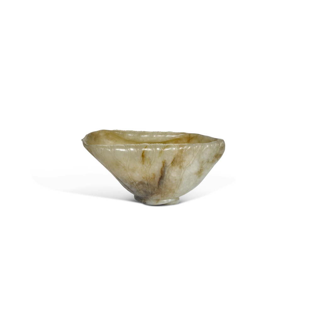 View full screen - View 1 of Lot 62. A russet jade 'lotus leaf' vessel, Yuan dynasty.