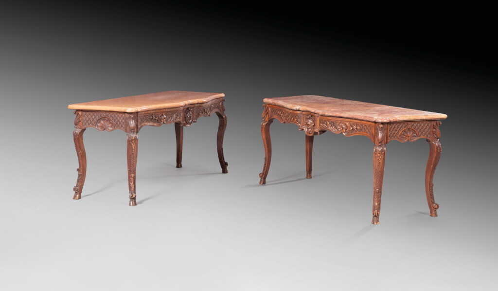 View full screen - View 1 of Lot 58. A pair of carved oak consoles, one Louis XV period, circa 1740, the other one from a later period | Paire de consoles en chêne sculpté, une d'époque Louis XV vers 1740 et l'autre d'époque postérieure.