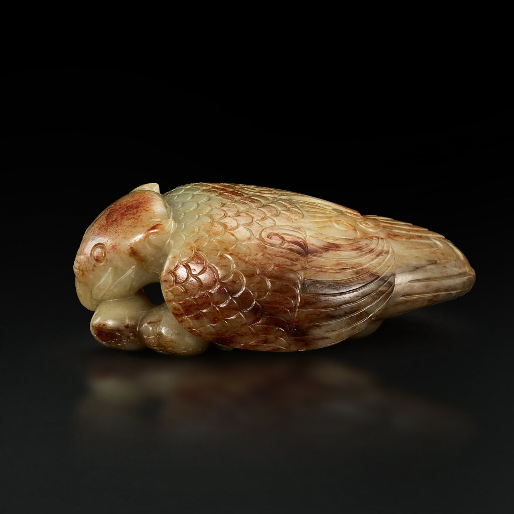 View full screen - View 1 of Lot 3678. A celadon and russet jade 'bird and peach' group, 17th century | 十七世紀 青白玉瑞鳥銜桃.
