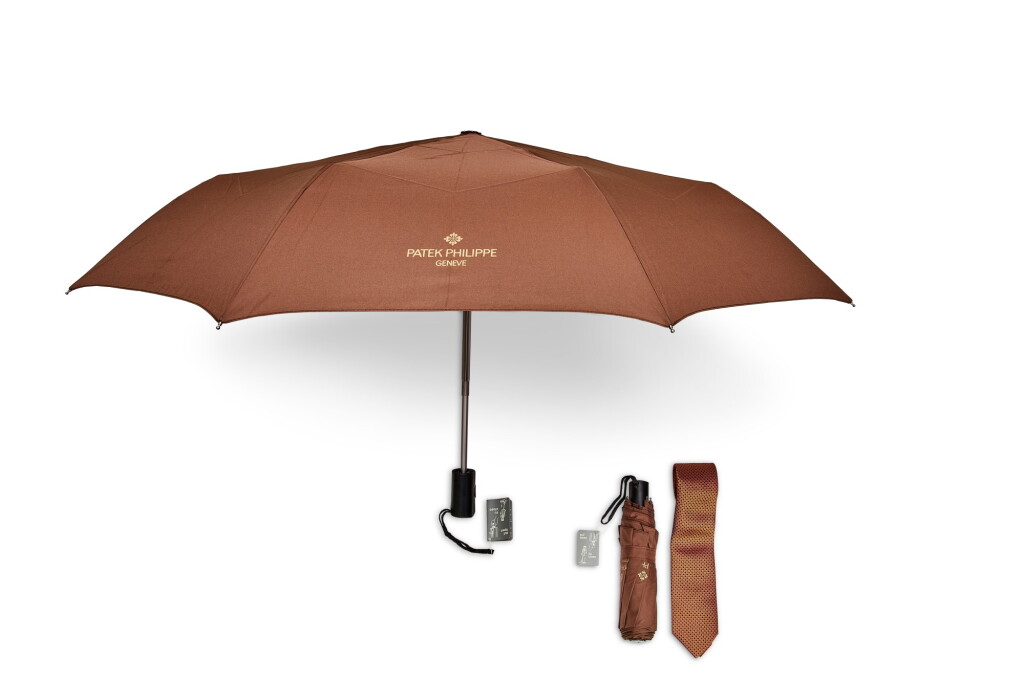 View full screen - View 1 of Lot 8182. A set of two folding umbrellas and silk tie, Circa 2015 and 2020 | 百達翡麗 | 一套兩把雨傘及領帶,約2015及2020年製.
