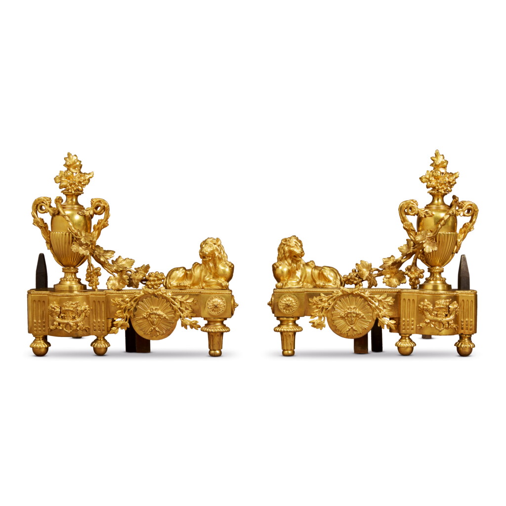 View full screen - View 1 of Lot 187. A PAIR OF LOUIS XVI STYLE ORMOLU CHENETS, 19TH CENTURY.