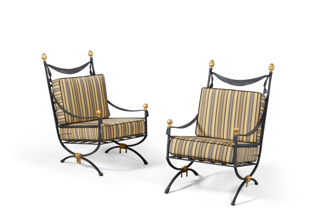 View full screen - View 1 of Lot 187. A Pair of Grey/Black Painted and Parcel Gilt Wrought Iron Low Armchairs, Supplied by JP Molyneux Studio Ltd.