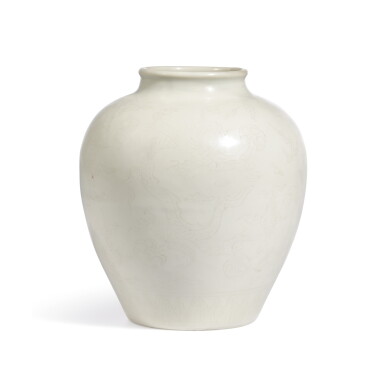View full screen - View 1 of Lot 3. AN INCISED WHITE-GLAZED 'DRAGON' JAR, JIAJING MARK AND PERIOD | 明嘉靖 白釉暗花雲龍紋罐 《大明嘉靖年製》款.