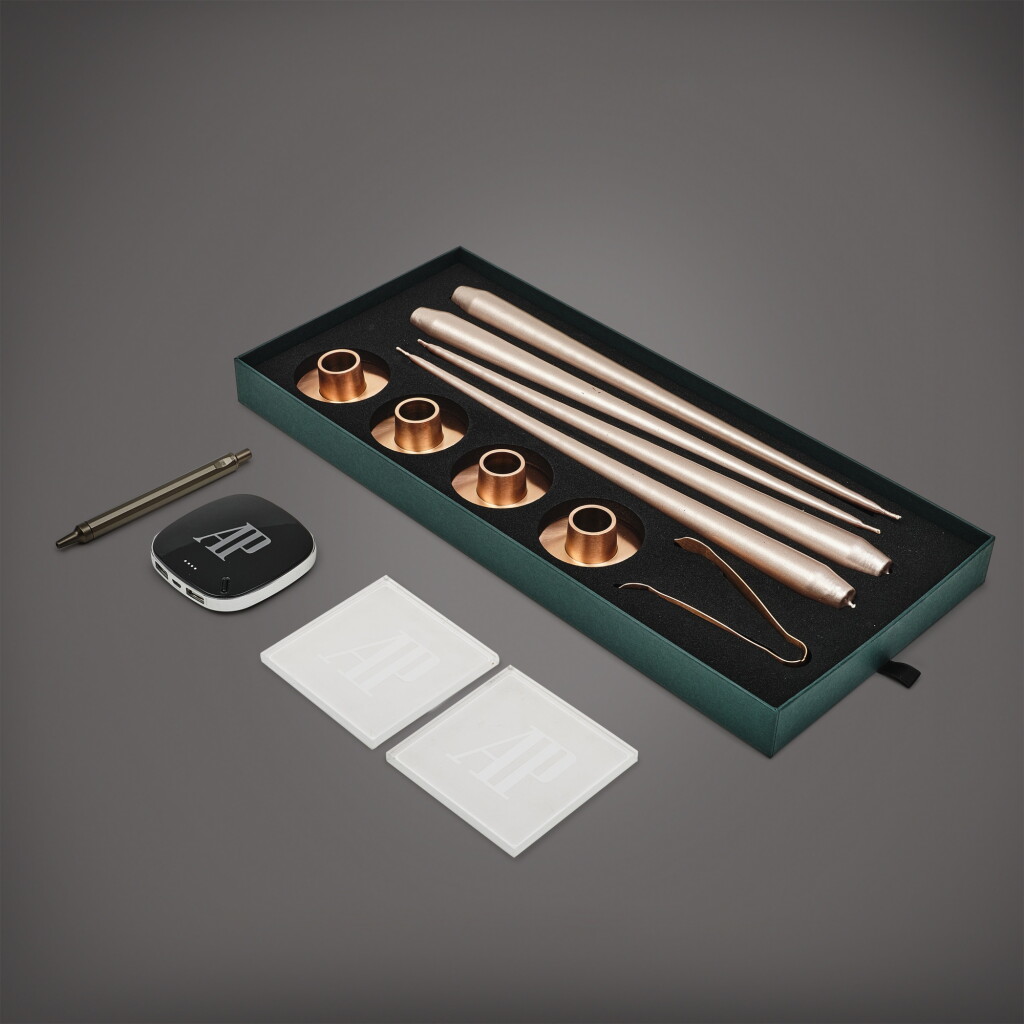 View full screen - View 1 of Lot 8700. A set of four Christmas candles, ballpoint pen, power bank and two coasters, Circa 2020 | 愛彼 | 一套四件聖誕蠟燭、圓珠筆、攜帶式充電器及兩件杯墊,約2020年製.