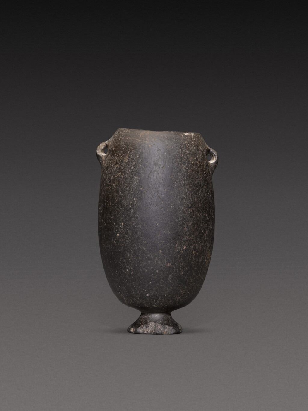 View full screen - View 1 of Lot 130. An Egyptian Basalt Jar, Predynastic Period, Naqada I/II, circa 4000-3200 B.C..