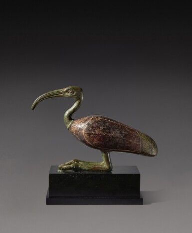 View full screen - View 1 of Lot 102. An Egyptian Bronze and Wood Figure of an Ibis, Late Period, 716-30 B.C..