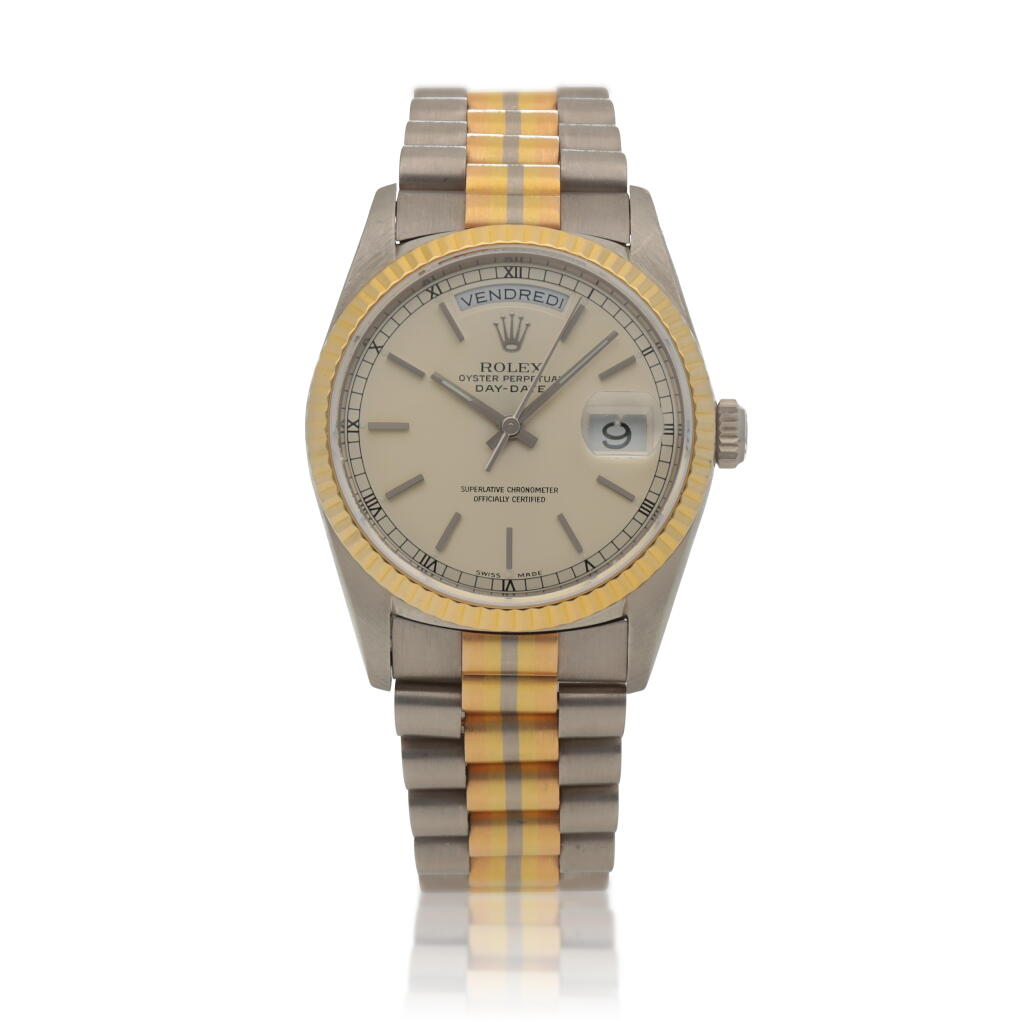View full screen - View 1 of Lot 108. Retailed by Bucherer: Tridor Day-Date, Ref. 18239B White, yellow and pink gold wristwatch with day, date and bracelet Circa 1996.