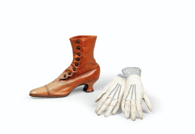 View full screen - View 1 of Lot 117. Lot including a leather boot and a pair of leather and blue embroidery gloves, circa 1900.