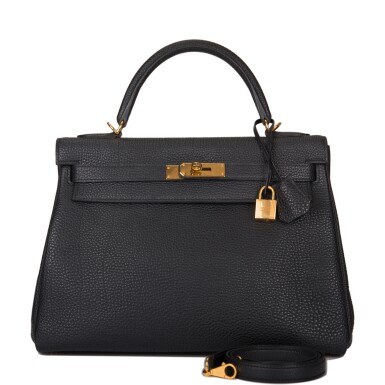 View full screen - View 1 of Lot 47. HERMÈS | BLACK RETOURNE KELLY 32CM OF CLEMENCE LEATHER WITH GOLD HARDWARE.