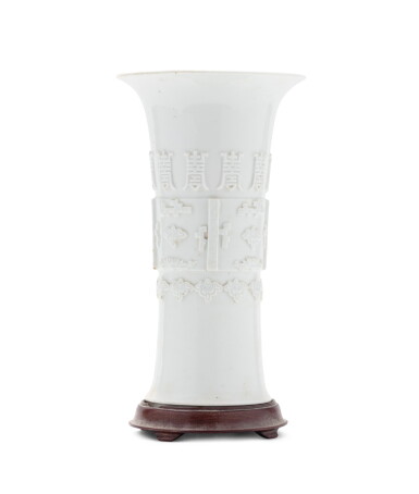 View full screen - View 1 of Lot 8. A white-glazed archaic beaker vase Qing dynasty, 18th-19th century | 清十八至十九世紀 白釉壽字紋花觚.