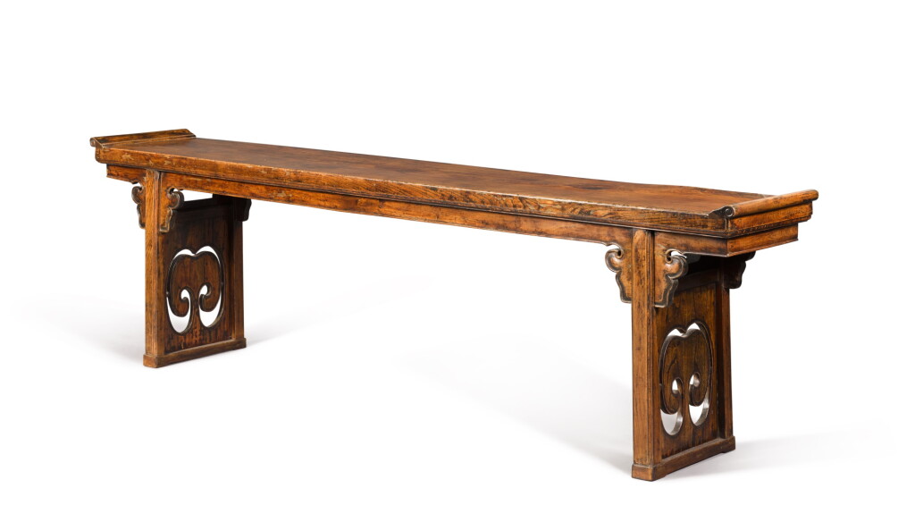 View full screen - View 1 of Lot 281. A massive elmwood altar table (Qiaotouan), Qing dynasty, 19th century | 清十九世紀 榆木鏤雕如意紋翹頭案.