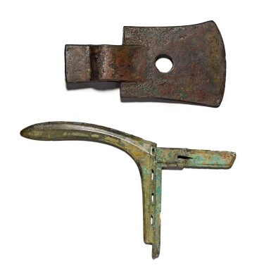 View full screen - View 1 of Lot 4. A bronze socketed axe head and a bronze halberd blade (ge) The socketed axe Shang dynasty, the halberd blade Eastern Zhou dynasty, Warring States period | 商 青銅斧 及 東周 戰國時期 青銅戈.