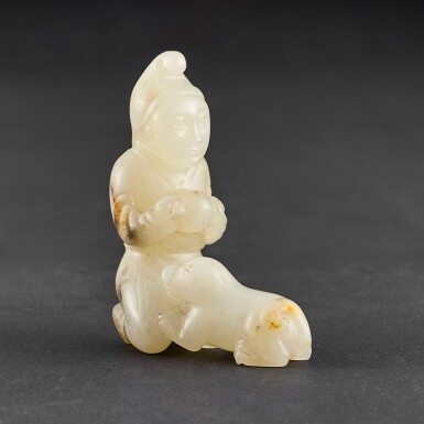 View full screen - View 1 of Lot 556. A WHITE JADE 'FOREIGNER AND DOG' GROUP PROBABLY QING DYNASTY | 或清 白玉胡人戲犬把件.