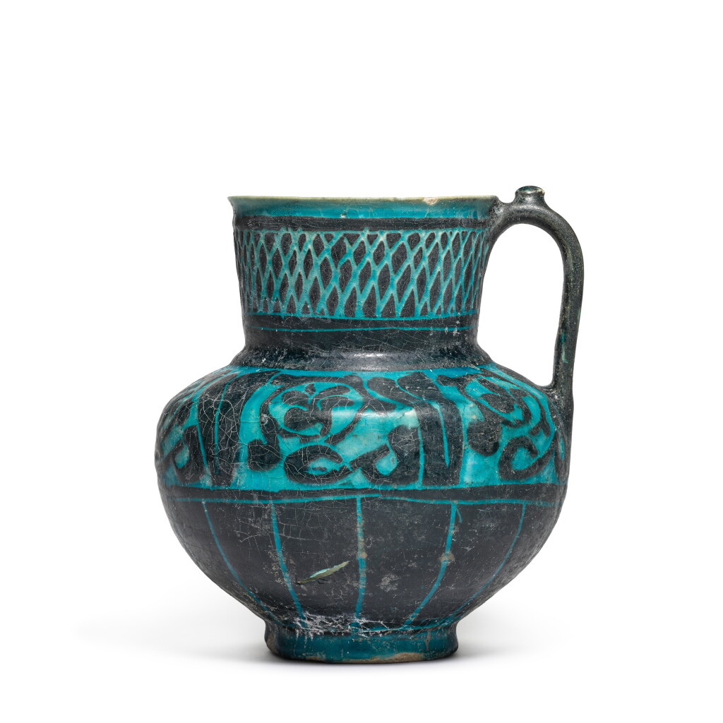View full screen - View 1 of Lot 64. A Kashan turquoise-glazed silhouette-ware jug, Persia, 12th/13th century.
