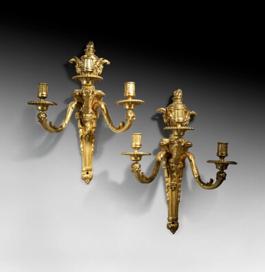 View full screen - View 1 of Lot 61. A pair of giltbronze wall-lights, Louis XVI, signed PAJOT | Paire d'appliques au masque d'Hercule en bronze doré d'époque Louis XVI, signée PAJOT.