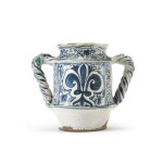 An Italian maiolica two-handled albarello, Florence District, circa 1450, with later handle