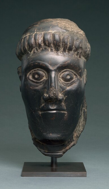 View full screen - View 1 of Lot 6. IRISH, CIRCA 11TH CENTURY | HEAD OF A BISHOP SAINT.