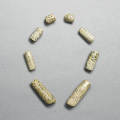 View full screen - View 1 of Lot 702. A set of eight celadon jade beads, Neolithic period, Xinglongwa culture | 新石器時代 興隆窪文化 玉管一組八件.