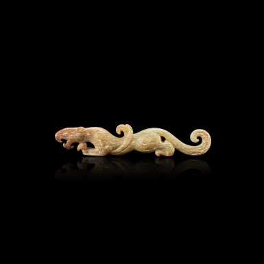 View full screen - View 1 of Lot 3029. A calcified celadon and russet jade winged tiger, Eastern Han dynasty or later 東漢或以後 青白玉翼虎.