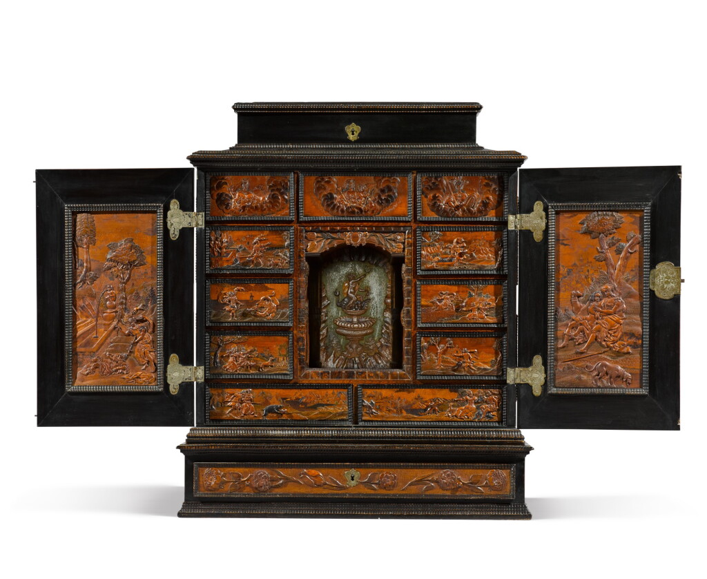 View full screen - View 1 of Lot 17. A Bohemian carved walnut and ebonised cabinet attributed to Adam Eck, Eger, mid-17th century.