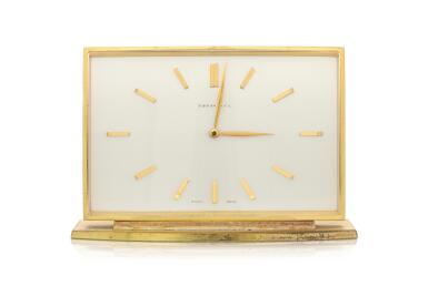 View full screen - View 1 of Lot 177. A gilt 8-day rectangular desk clock, Circa 1970.