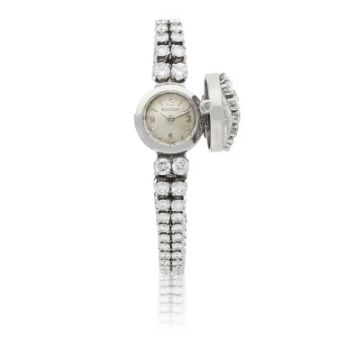 View full screen - View 1 of Lot 903. PLATINUM AND DIAMOND-SET BRACELET WATCH CIRCA 1955.
