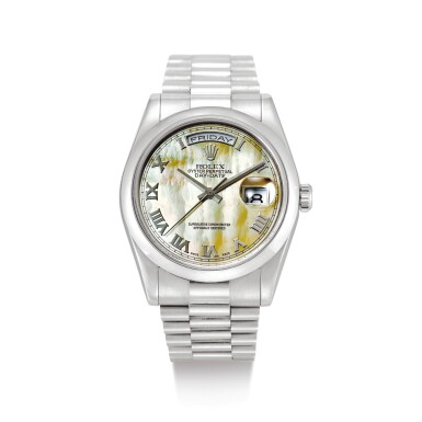 View full screen - View 1 of Lot 2114. ROLEX | DAY-DATE, REFERENCE 118209 A WHITE GOLD WRISTWATCH WITH DAY, DATE, MOTHER-OF-PEARL DIAL AND BRACELET, CIRCA 2002 " | 勞力士 | Day-Date 型號118209 白金鏈帶腕錶,備日期、星期顯示及珠母貝錶盤,錶殼編號Y469943,約2002年製" .