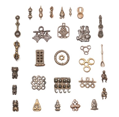 View full screen - View 1 of Lot 48. A study collection of thirty ornaments, Thokcha, Tibet and other Himalayan regions, 11th/14th century | 西藏及喜馬拉雅其他地區 十一至十四世紀 托查一組三十件.