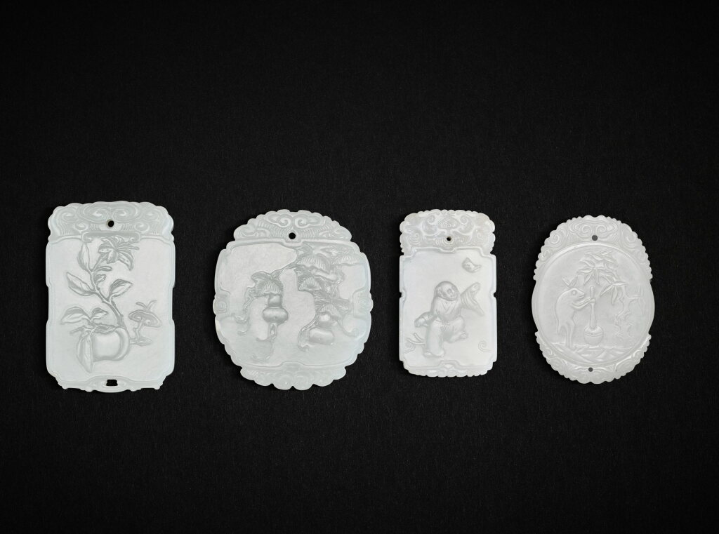 View full screen - View 1 of Lot 5589. Three inscribed white jade plaques and a pale celadon jade plaque, Qing dynasty, 19th century 清十九世紀 白玉「福自天來」、「福壽綿綿」、「百事如意」牌 及 青白玉月兔搗藥圖牌一組四件.