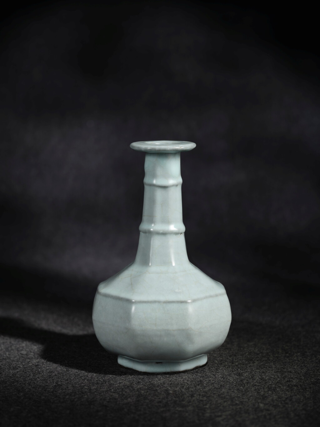 View full screen - View 1 of Lot 43. An exceedingly rare guan-glazed octagonal bottle vase, Song dynasty or later | 宋或較晚 官釉八方弦紋盤口瓶.