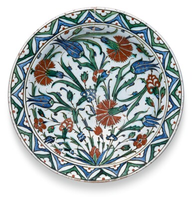 View full screen - View 1 of Lot 271. A LARGE IZNIK POLYCHROME POTTERY DISH WITH FLORAL BORDER, TURKEY, CIRCA 1580-85.