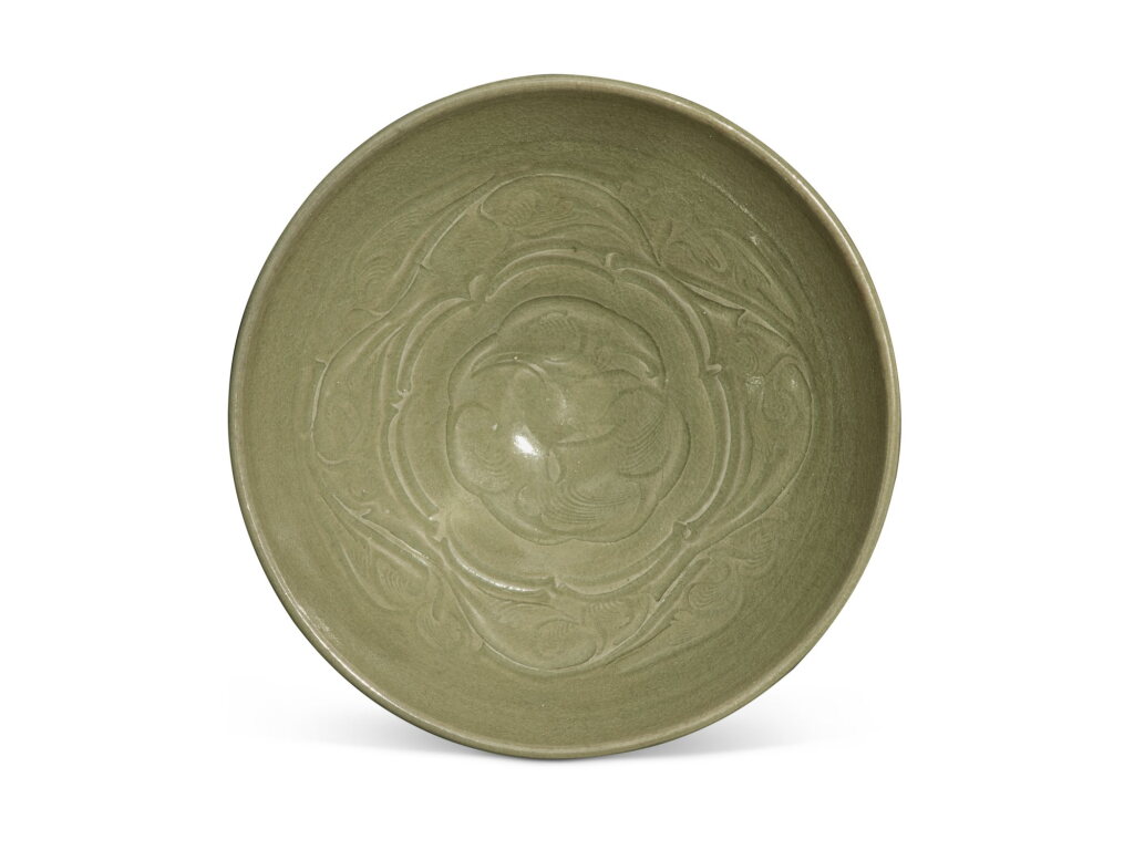 View full screen - View 1 of Lot 324. A large carved 'Yaozhou' celadon-glazed 'floral' bowl, Northern Song dynasty | 北宋 耀州窰青釉刻花大盌.