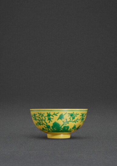 View full screen - View 1 of Lot 28. An incised yellow-ground green-enamelled 'longevity' bowl, Mark and period of Yongzheng | 清雍正 黃地綠彩壽桃喜鵲盌 《大清雍正年製》款.