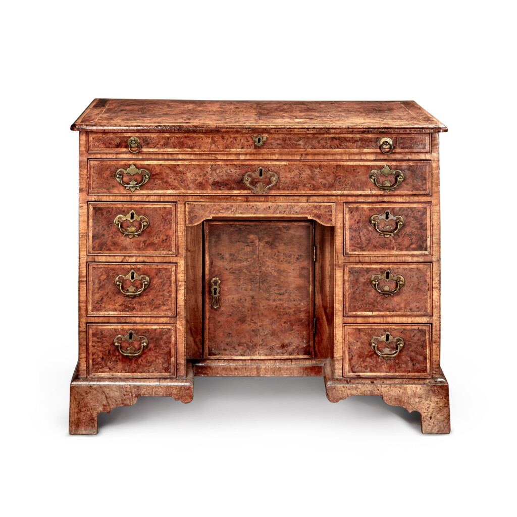 View full screen - View 1 of Lot 23. A George II Burr Yew and Walnut Kneehole Desk, Circa 1730.