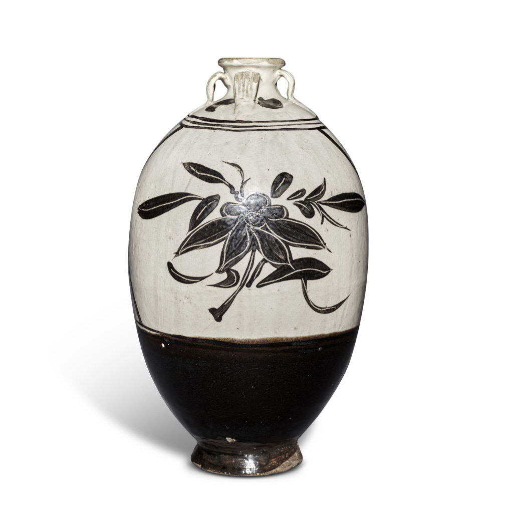 View full screen - View 1 of Lot 32. A painted 'Cizhou' 'floral' handled jar, Yuan - Ming dynasty | 元至明 磁州窰白地黑花花卉紋四繫罐.