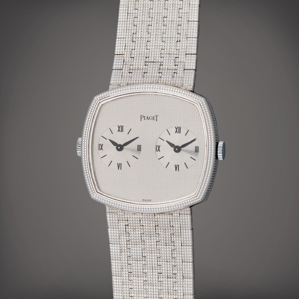 View full screen - View 1 of Lot 128. Reference 612401 A4 | A white gold dual time bracelet watch with two movements | Circa 1975 .