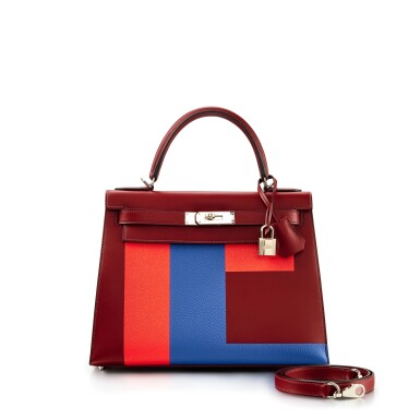 View full screen - View 1 of Lot 7793. Limited Edition Bordeaux Sombrero, Capucine Epsom and Bleu Brighton Clemence Kellygraphie Lettre E Kelly 28 Sellier Palladium Hardware, 2017.