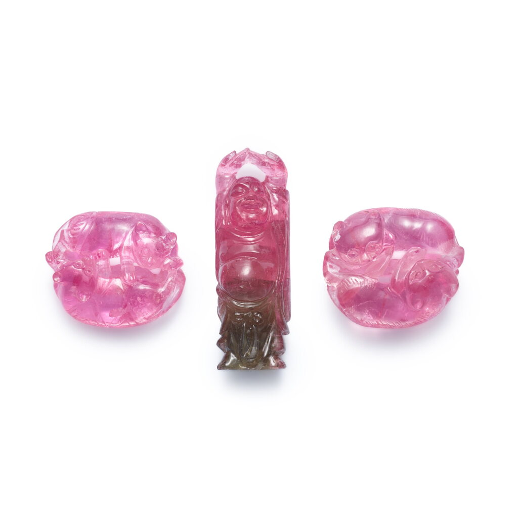View full screen - View 1 of Lot 592. Three carved tourmaline pendants, Qing dynasty, 18th - 19th century 清十八至十九世紀 碧璽雕雙獾珮 及 布袋珮一組三件.