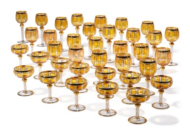 View full screen - View 1 of Lot 270. A BOHEMIAN AMBER-TINTED AND GILT GLASS PART-TABLE SERVICE, LATE 19TH/20TH CENTURY.