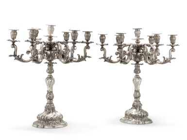 View full screen - View 1 of Lot 25. A pair of large seven-light silver candelabra, Mario Buccellati, Milan, circa 1940 | Paire de grands chandeliers à sept lumières en argent par Mario Buccellati, Milan, vers 1940.