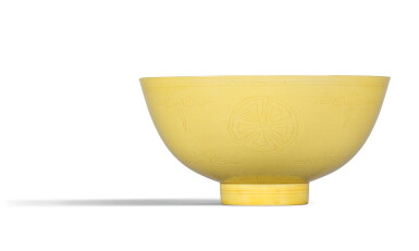 View full screen - View 1 of Lot 18. A YELLOW-GLAZED BOWL , KANGXI MARK AND PERIOD | 清康熙 黃釉刻團花紋盌 《大清康熙年製》款.