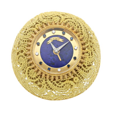 View full screen - View 1 of Lot 252. A YELLOW GOLD AND GILT-BRASS ALARM DESK TIMEPIECE WITH LAPIS LAZULI, DIAMOND AND SAPPHIRE-SET DIAL, CIRCA 1970.
