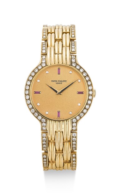 View full screen - View 1 of Lot 47. PATEK PHILIPPE | CALATRAVA JOALLERIE, REFERENCE 3965, A YELLOW GOLD, DIAMOND AND RUBY-SET BRACELET WATCH, CIRCA 1989.
