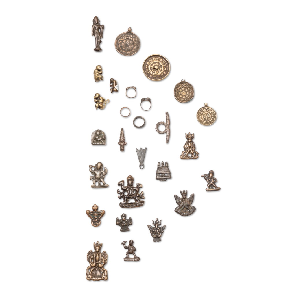 View full screen - View 1 of Lot 49. A study collection of twenty-seven ornaments, Thokcha, Himalayan regions, Central Asia and China, 9th - 14th century.