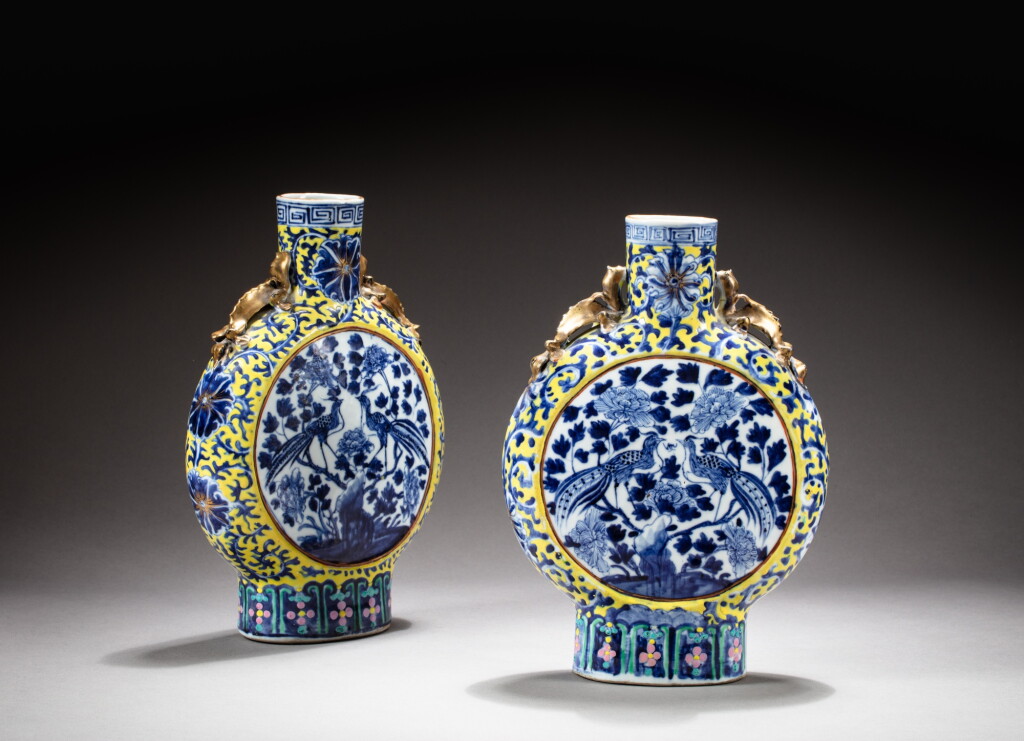 View full screen - View 1 of Lot 224. A pair of yellow-ground blue and white moon flasks, Qing dynasty, 19th century | 清十九世紀 黃地青花花鳥紋抱月瓶一對.