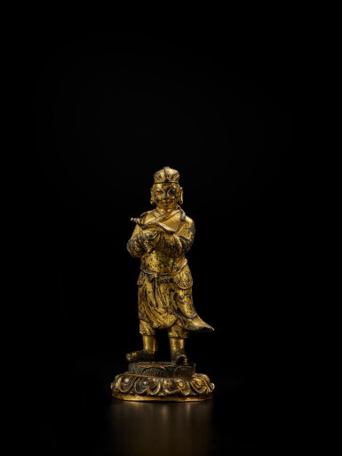 View full screen - View 1 of Lot 404. A gilt-bronze Daoist figure, Late Ming dynasty | 明末 銅鎏金道教人物立像.
